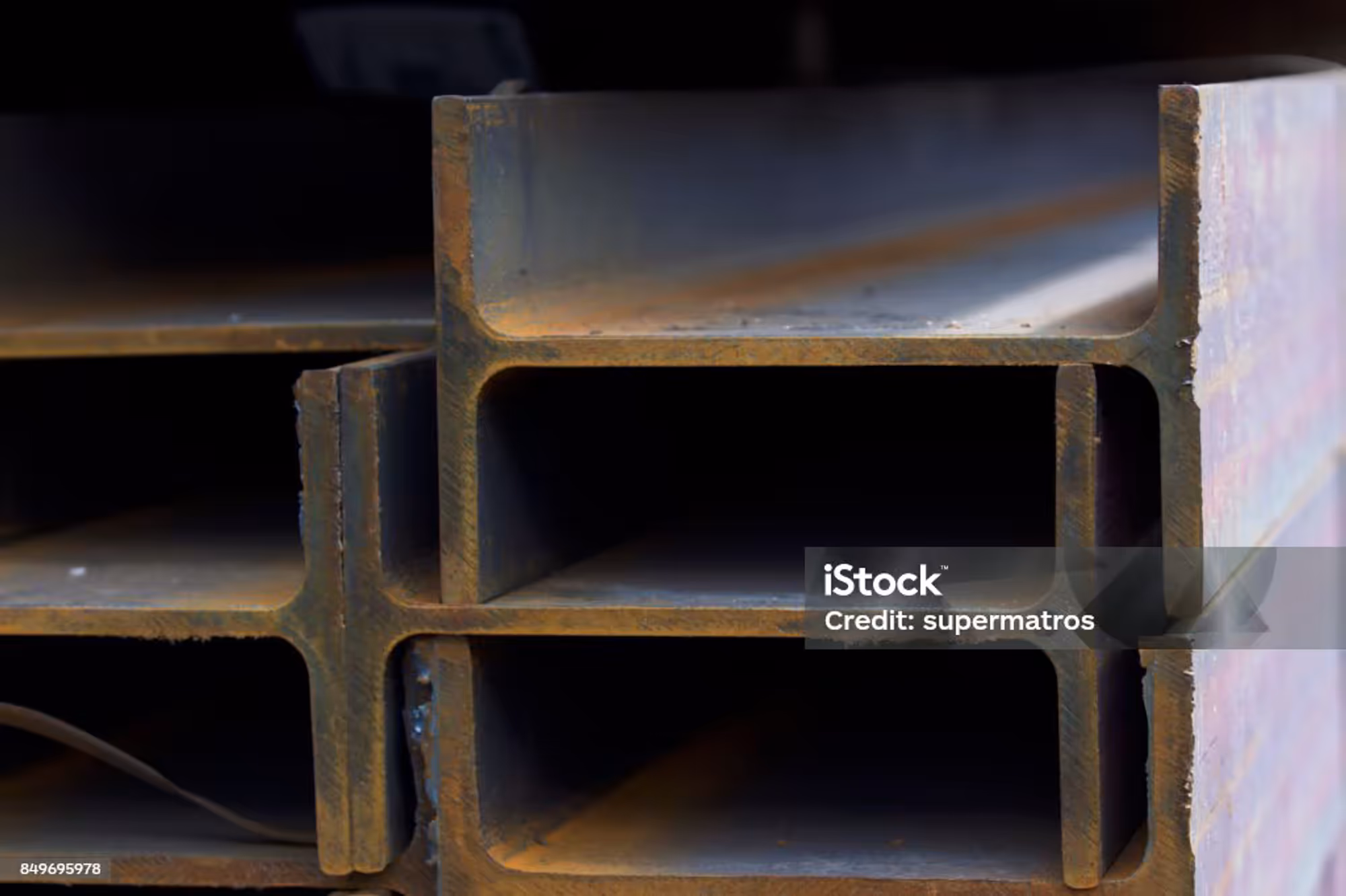 Stacked structural steel sections.